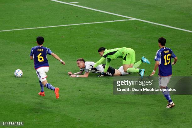 David Raum of Germany is fouled by Shuichi Gonda of Japan resulting in a penalty during the FIFA World Cup Qatar 2022 Group E match between Germany...