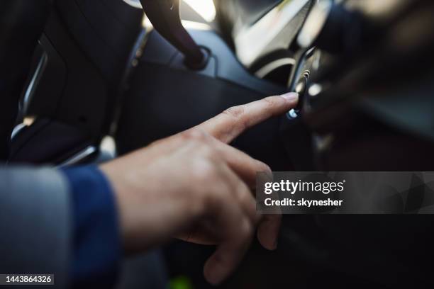 pushing start/stop engine button in a car! - start or stop button stock pictures, royalty-free photos & images