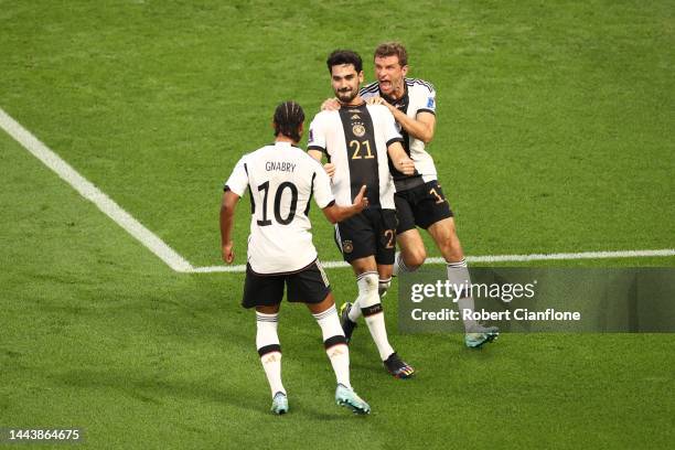 Ilkay Guendogan of Germany celebrates with Serge Gnabry and Thomas Mueller after scoring their team's first goal via a penalty during the FIFA World...