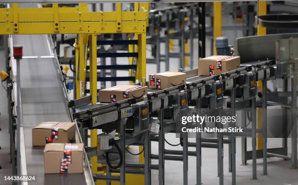 Amazon packages move on a conveyer belt at Rugeley Amazon Fulfilment Centre on November 23, 2022 in Rugeley, England. Black Friday will start on...