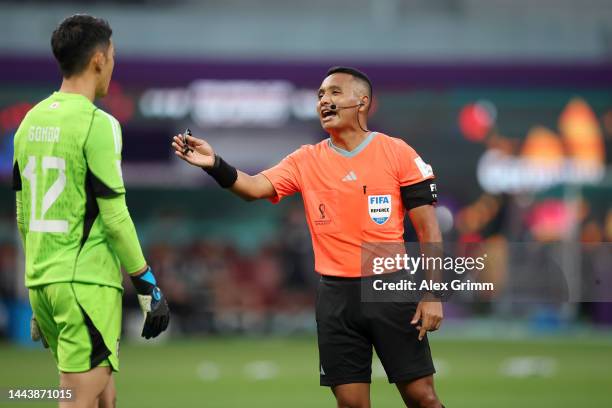 Shuichi Gonda of Japan speaks with referee Ivan Arcides Barton Cisneros after a foul on David Raum of Germany resulting in a penalty during the FIFA...