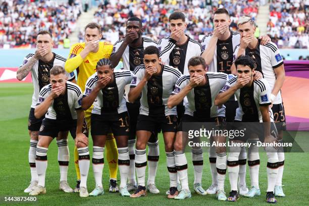 Germany players cover their mouths in protest as they pose for a team photo during the FIFA World Cup Qatar 2022 Group E match between Germany and...