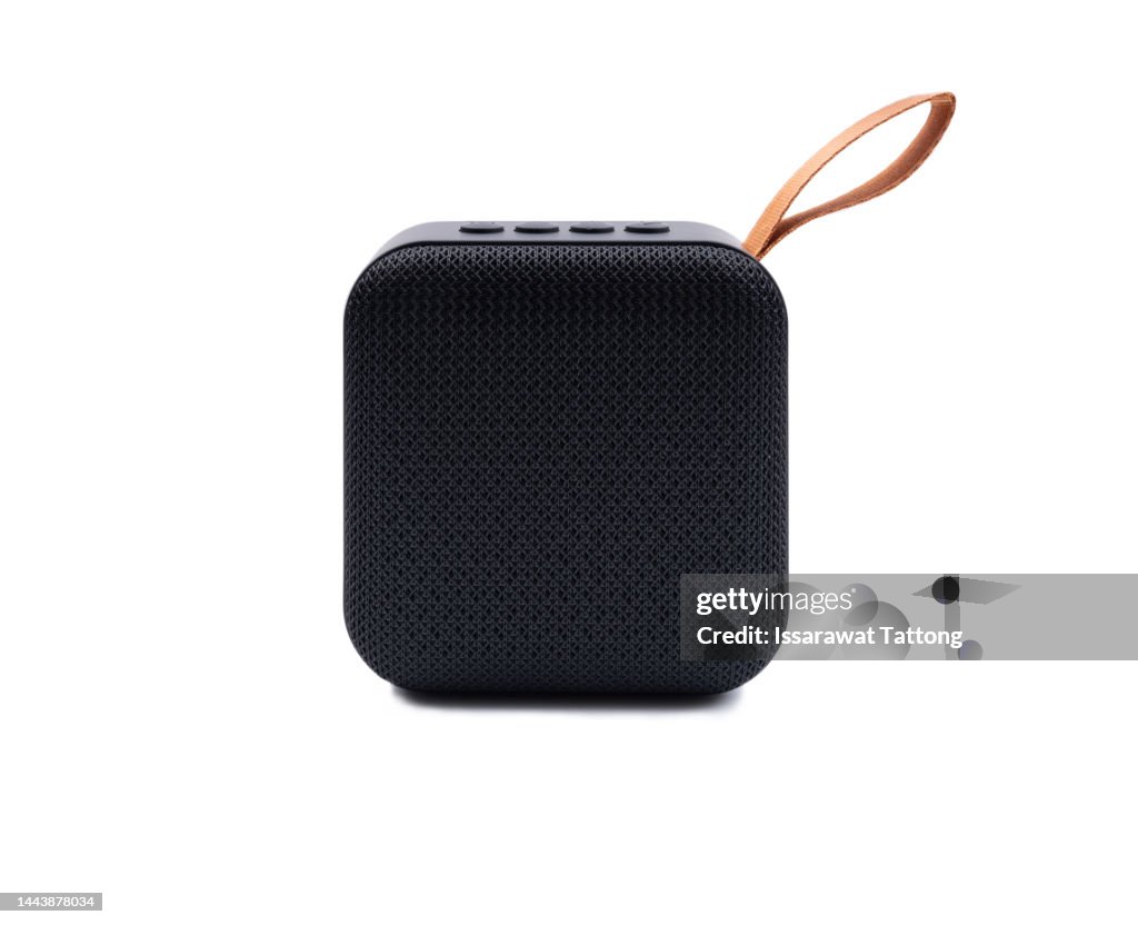 Portable wireless speaker isolated on white background. Concept listening to music on the street.