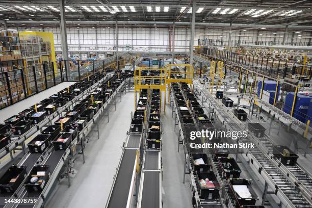 Items move on a conveyer belt before they're packaged at Rugeley Amazon Fulfilment Centre on November 23, 2022 in Rugeley, England. Black Friday will...
