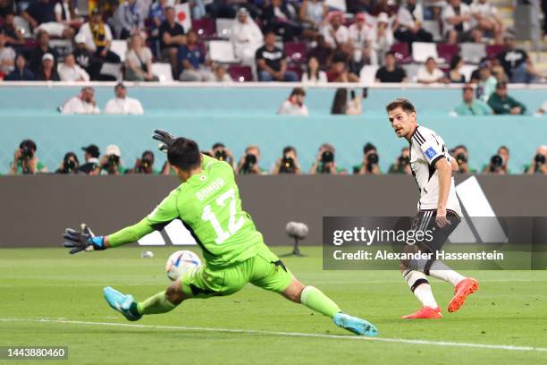Shuichi Gonda of Japan makes a save against Jonas Hofmann of Germany during the FIFA World Cup Qatar 2022 Group E match between Germany and Japan at...