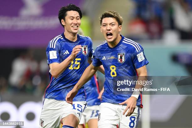 Ritsu Doan of Japan celebrates with Daichi Kamada after scoring their team's first goal during the FIFA World Cup Qatar 2022 Group E match between...