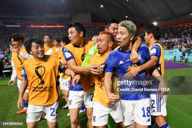 Takuma Asano of Japan celebrates scoring their second goal with their teammates during the FIFA World Cup Qatar 2022 Group E match between Germany...