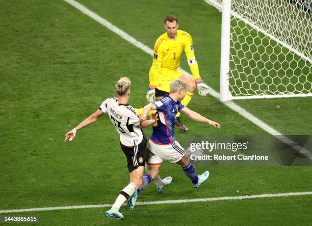 Takuma Asano of Japan scores their team's second goal past Manuel Neuer of Germany during the FIFA World Cup Qatar 2022 Group E match between Germany...