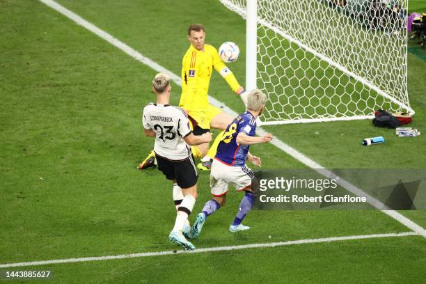 Takuma Asano of Japan scores their team's second goal past Manuel Neuer of Germany during the FIFA World Cup Qatar 2022 Group E match between Germany...