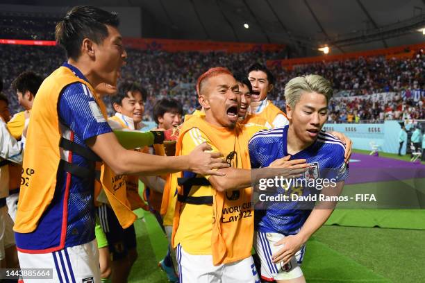 Takuma Asano of Japan celebrates scoring their second goal with their teammates during the FIFA World Cup Qatar 2022 Group E match between Germany...