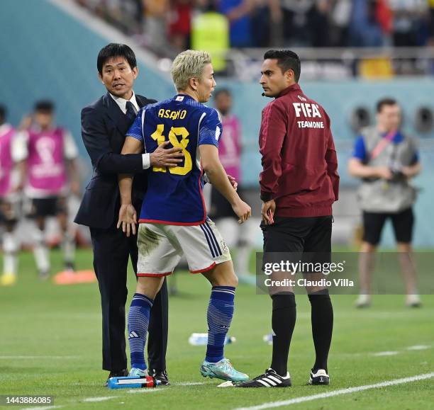 Takuma Asano of Japan celebrates their second goal with head coach Hajime Moriyasu during the FIFA World Cup Qatar 2022 Group E match between Germany...