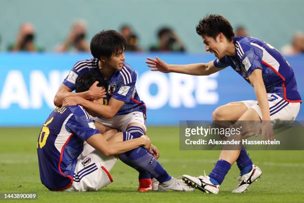 Takehiro Tomiyasu and Kaoru Mitoma of Japan celebrate after the 2-1 win during the FIFA World Cup Qatar 2022 Group E match between Germany and Japan...
