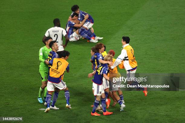 Japan players celebrate the 2-1 win during the FIFA World Cup Qatar 2022 Group E match between Germany and Japan at Khalifa International Stadium on...