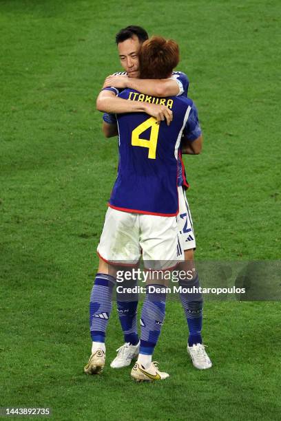 Maya Yoshida and Kou Itakura of Japan celebrate the 2-1 win in the FIFA World Cup Qatar 2022 Group E match between Germany and Japan at Khalifa...