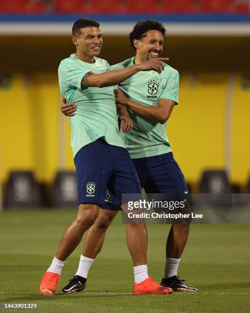 Thiago Silva and Marquinhos of Brazil react during Brazil match day -1 training session at Al Arabi SC Stadium on November 23, 2022 in Doha, Qatar.