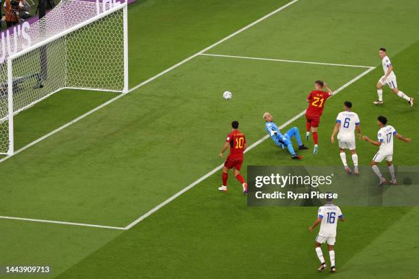 Dani Olmo of Spain scores their team's first goal past Keylor Navas of Costa Rica during the FIFA World Cup Qatar 2022 Group E match between Spain...