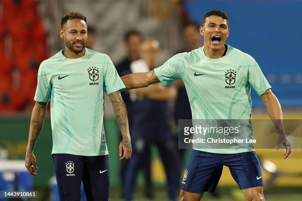 Neymar and Richarlison of Brazil react during Brazil match day -1 training session at Al Arabi SC Stadium on November 23, 2022 in Doha, Qatar.