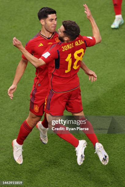 Marco Asensio of Spain celebrates with Jordi Alba after scoring their team's second goal during the FIFA World Cup Qatar 2022 Group E match between...