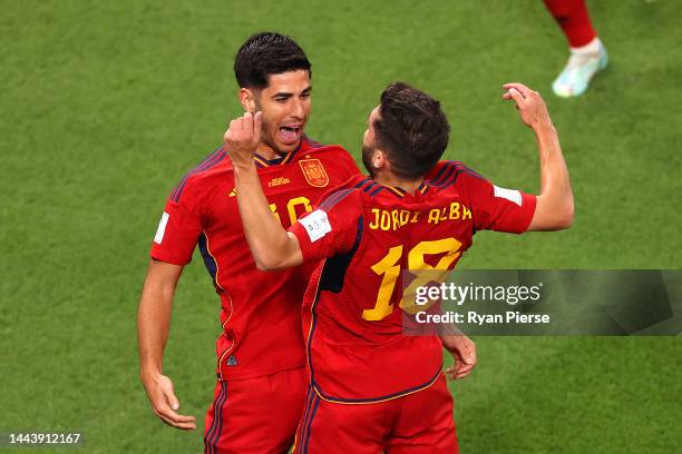 Marco Asensio of Spain celebrates with their teammate Jordi Alba after scoring their team's second goal during the FIFA World Cup Qatar 2022 Group E...