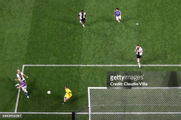 Takuma Asano of Japan scores their team's second goal past Manuel Neuer of Germany during the FIFA World Cup Qatar 2022 Group E match between Germany...
