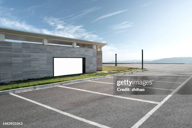 asphalt parking lot on a sunny day - last parking space stock pictures, royalty-free photos & images