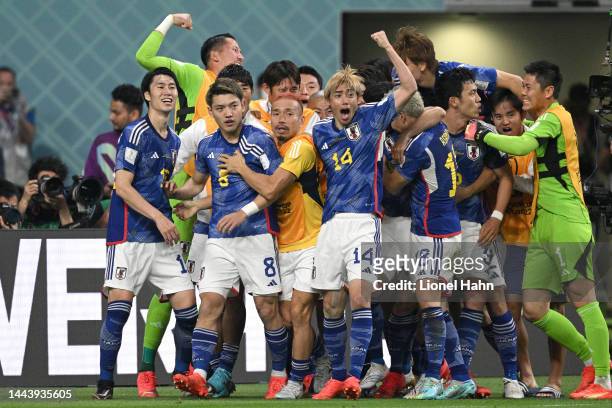 Japan squad celebrates Ritsu Doan goal equalizer during the FIFA World Cup Qatar 2022 Group E match between Germany and Japan at Khalifa...