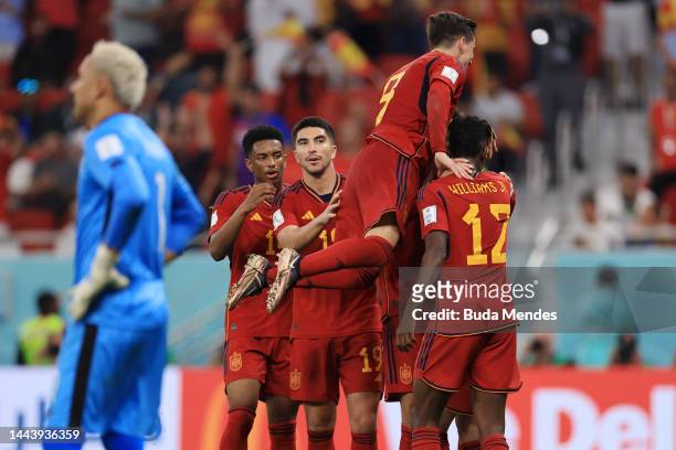 Alvaro Morata of Spain celebrates with teammates after scoring their team's seventh goal during the FIFA World Cup Qatar 2022 Group E match between...