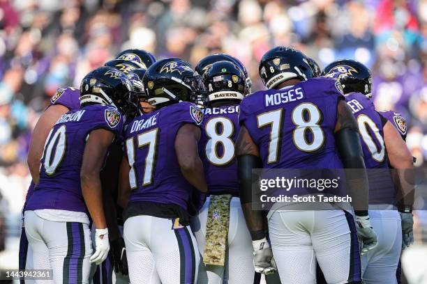 General view as Lamar Jackson of the Baltimore Ravens leads the offense in a huddle during the first half against the Carolina Panthers at M&T Bank...