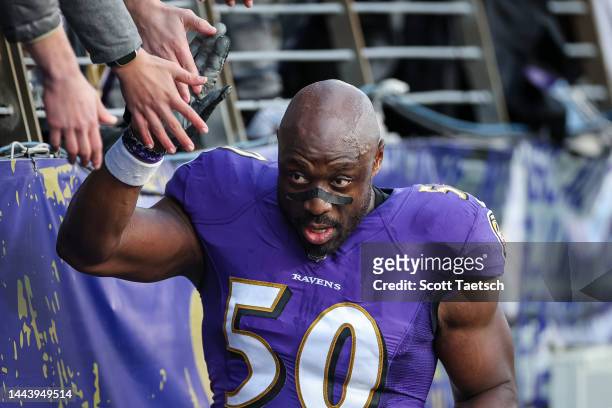 Justin Houston of the Baltimore Ravens interacts with fans after the game against the Carolina Panthers at M&T Bank Stadium on November 20, 2022 in...