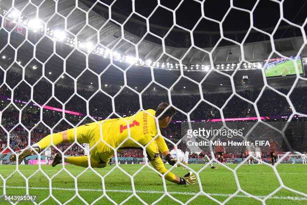 Thibaut Courtois of Belgium saves the penalty taken by Alphonso Davies of Canada during the FIFA World Cup Qatar 2022 Group F match between Belgium...