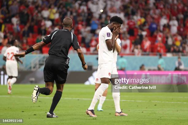 Alphonso Davies of Canada reacts after Thibaut Courtois of Belgium saves their penalty attempt during the FIFA World Cup Qatar 2022 Group F match...