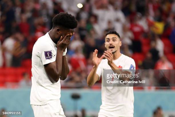 Alphonso Davies of Canada reacts after Thibaut Courtois of Belgium saves their penalty attempt during the FIFA World Cup Qatar 2022 Group F match...