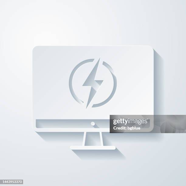 desktop computer with electricity symbol. icon with paper cut effect on blank background - electrical shock stock illustrations