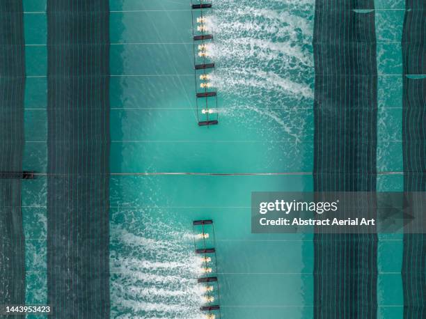 sprinklers in a water treatment tank photographed from directly above, vietnam - water treatment stock-fotos und bilder