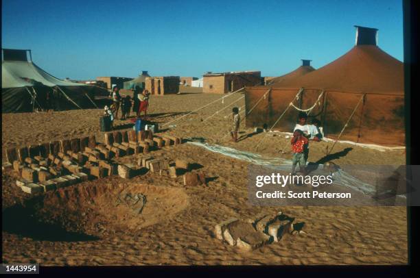 Children stand at the Auserd refugee camp June 18, 1997 near Tindouf, Algeria. Since 1976, Morocco and the Polisario Front have been fighting for...