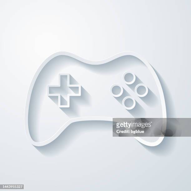 game controller. icon with paper cut effect on blank background - gamepad stock illustrations