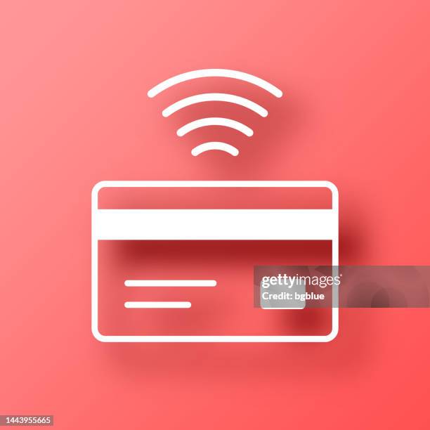 contactless credit card. icon on red background with shadow - nfc icon stock illustrations