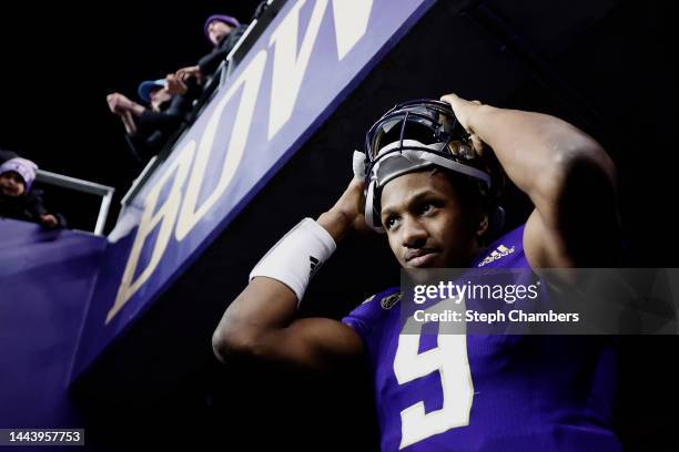 Michael Penix Jr. #9 of the Washington Huskies reacts after beating Colorado Buffaloes 54-7 at Husky Stadium on November 19, 2022 in Seattle,...