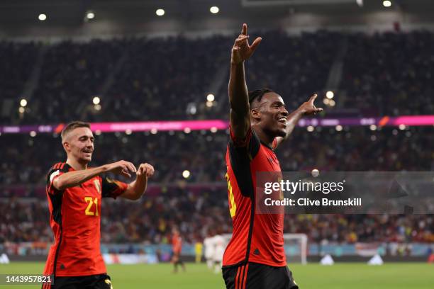 Michy Batshuayi of Belgium celebrates scoring their first goal with their teammate Timothy Castagne during the FIFA World Cup Qatar 2022 Group F...