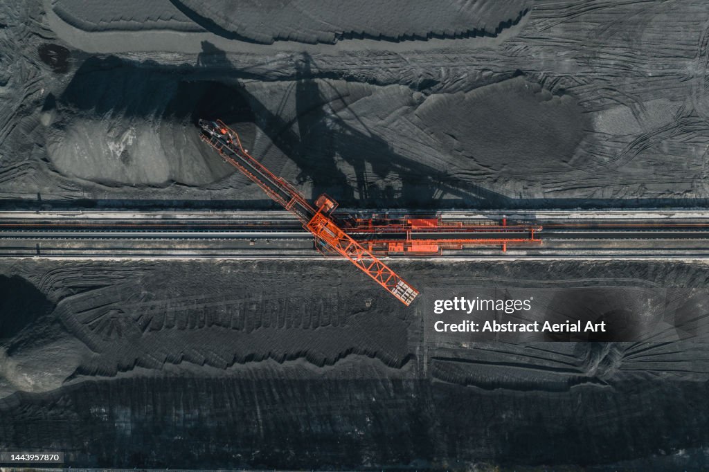 Aerial image directly above an industrial machine working in a coal pit, Vietnam