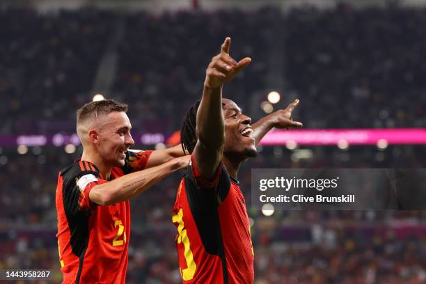 Michy Batshuayi of Belgium celebrates scoring their first goal with their teammate Timothy Castagne during the FIFA World Cup Qatar 2022 Group F...