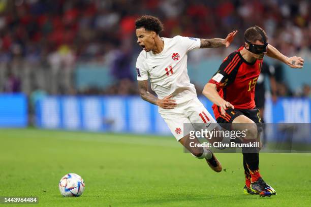 Tajon Buchanan of Canada battles for possession with Thomas Meunier of Belgium during the FIFA World Cup Qatar 2022 Group F match between Belgium and...