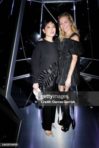 Sandra Choi and Sienna Miller attend Claridge's Christmas Tree 2022 Party with Jimmy Choo at Claridge's hotel on November 23, 2022 in London, England.