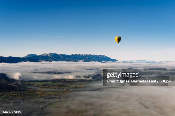 scenic view of hot air balloon against sky,cerdanya,spain - balloons in sky stock pictures, royalty-free photos & images