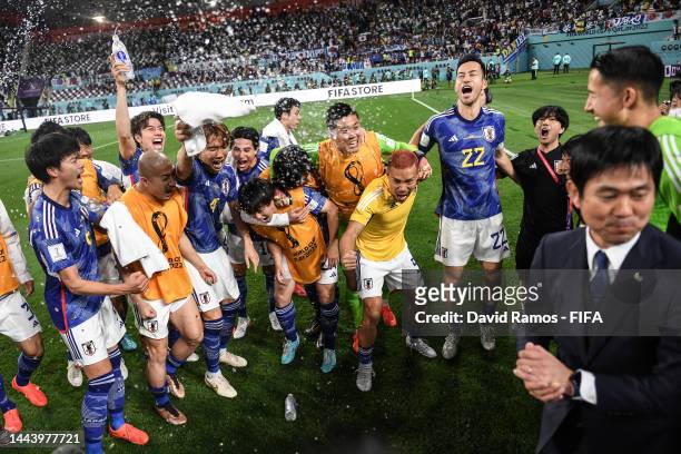 Japan players celebrate the 2-1 win during the FIFA World Cup Qatar 2022 Group E match between Germany and Japan at Khalifa International Stadium on...