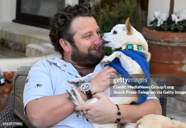 Long Beach, CA Alex Wolfe with his 22-year-old dog Gino in Manhattan Beach on Wednesday, November 23, 2022. Gino is part Chihuahua, part American...