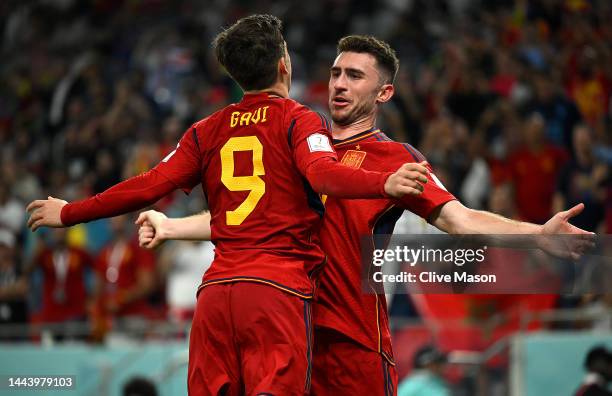 Gavi of Spain celebrates with Aymeric Laporte after scoring their team's fifth goal during the FIFA World Cup Qatar 2022 Group E match between Spain...