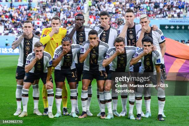 Germany players cover their mouths in protest as they pose for a team photo. Back row : David Raum, Manuel Neuer, Antonio Ruediger, Kai Havertz,...