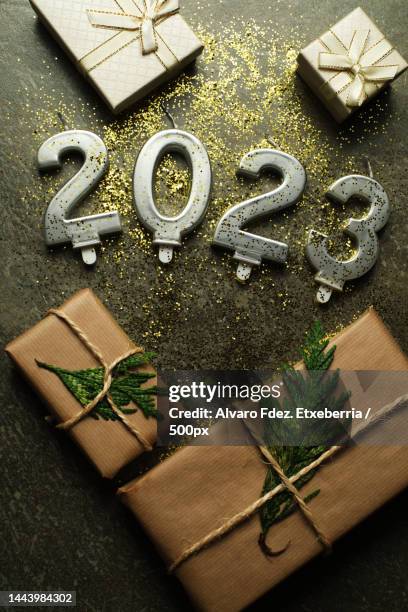 high angle view of gifts and new year concept 2023 on table - table font view stock pictures, royalty-free photos & images