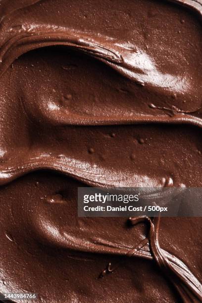 full frame shot of chocolate on brown background - chocolate concept stock pictures, royalty-free photos & images